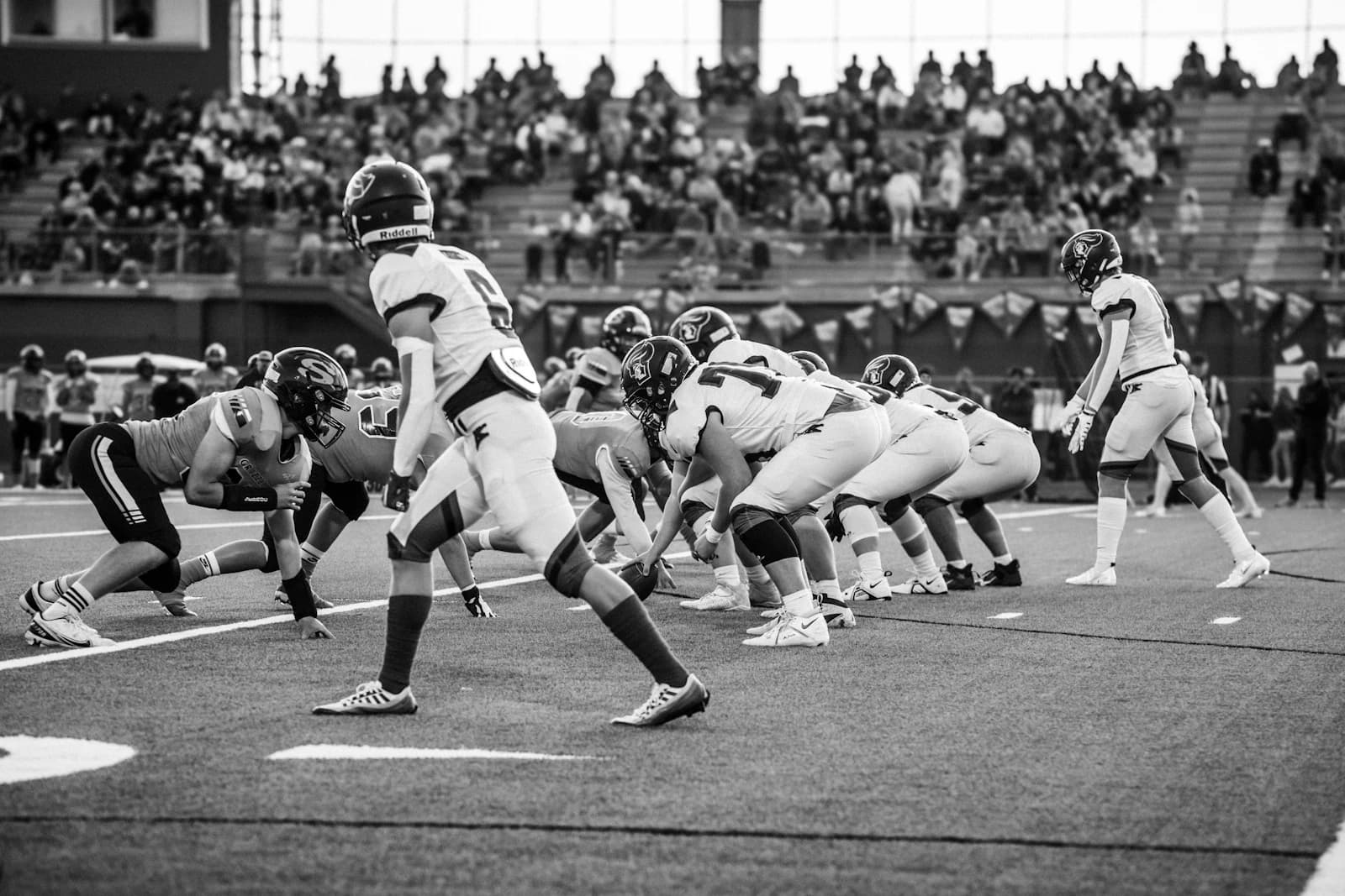 Football players lining up before the snap
